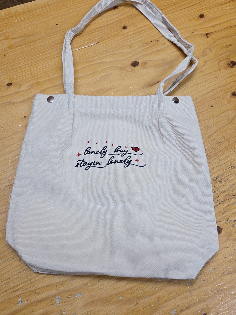 Cream Canvas Tote Bag with 'Lonely Boy Stayin' Lonely' Embroidery